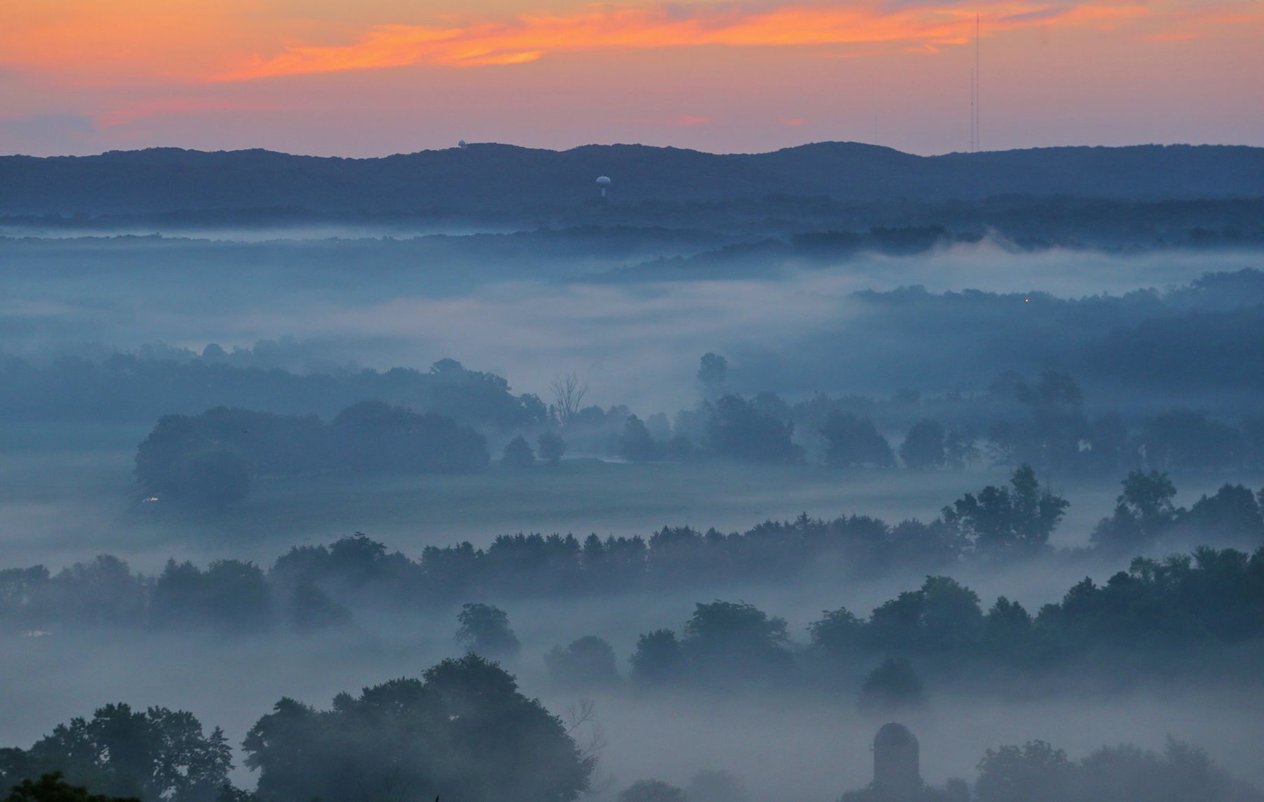Fog covers the farm fields in Cedar Hill